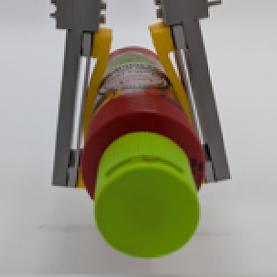 The gripper prototype holding a plastic bottle