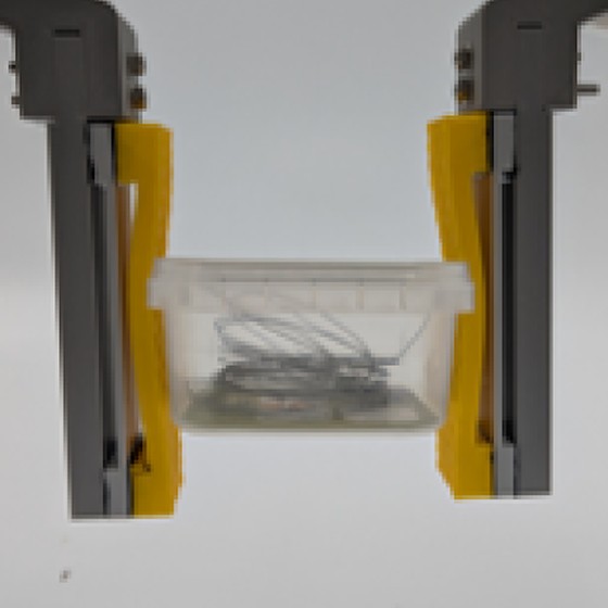 The gripper prototype holding a small box