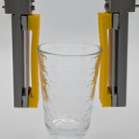 The gripper prototype holding a drinking glass